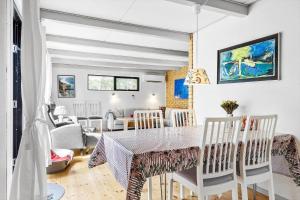 a dining room with a table and chairs at 84100-Ebeltoft-Magevej-4 in Ebeltoft