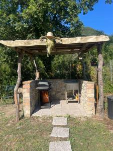 a stone oven with a roof on top of it at StNicholas Ranch Corfu Wild Camping in Benitses