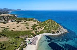 an aerial view of a small island in the ocean at Sant'Elmo Beach Hotel in Castiadas