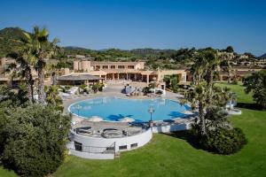 an aerial view of a house with a swimming pool at Sant'Elmo Beach Hotel in Castiadas