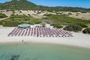 an aerial view of a parking lot on a beach at Sant'Elmo Beach Hotel in Castiadas +33 photos