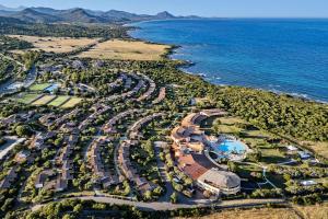 an aerial view of a resort next to the ocean at Sant'Elmo Beach Hotel in Castiadas