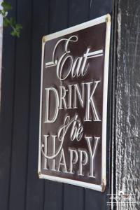 a sign that says out drink and be happy at The Kings Arms Hotel, Lostwithiel in Lostwithiel
