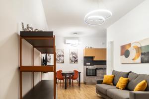 a living room with a couch and a table at La Casa al Centro in Policoro +54 photos