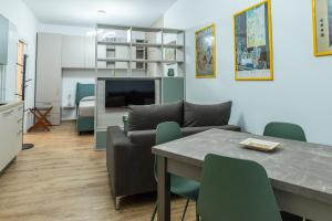 a living room with a couch and a table at La Casa al Centro in Policoro