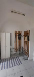 a room with two wooden chairs and a wall at Ela Gar 3 WG Zimmer in Garsten