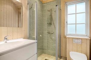 a bathroom with a shower and a sink and a toilet at 1523-Vejby-Store-Orebjergvej-53-B in Vejby +24 photos