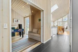 a living room with a couch and a table at 8302-Kolind-Falkevej-34 in Kolind