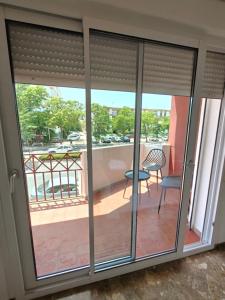 a sliding glass door with a view of a balcony at AYAMONTE ROOMS 43 in Ayamonte