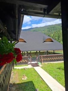 a view from a window of a house with a roof at Casa cu Poveste in Dorna Arini