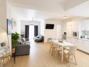 a living room with a couch and a table at Aroma D Valencia Luxury and Designer Apartment in Valencia +29 photos