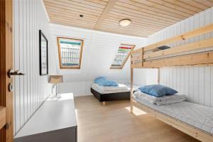a room with two bunk beds in a house at C11213-Hemmet-Alpehuen-4 in Hemmet