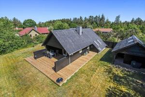 an overhead view of a house with a wooden deck at C11213-Hemmet-Alpehuen-4 in Hemmet