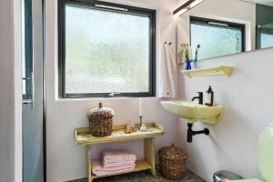 a bathroom with a sink and a window at 30111-Odder-Lundgaardsvej-7 in Odder +22 photos