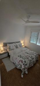 a bedroom with a bed and a window at Terraza al mar in Salobreña +9 photos