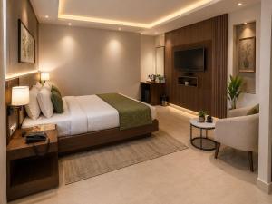 a hotel room with a bed and a tv at Airport Vistara Cove By Velocity Group Terminal 2,3 Delhi IGI Airport With free Airport Pickup in New Delhi