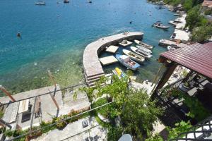 a group of boats docked in a body of water at Apartments Krivokapic in Perast