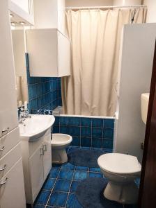 a bathroom with two sinks and a toilet and a shower at Zorica House Vrbas in Vrbas