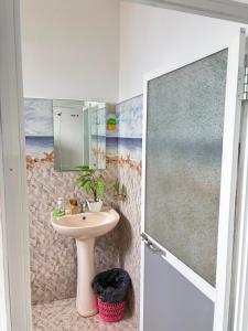 a bathroom with a sink and a mirror at top sea view guest in Mirissa +119 photos