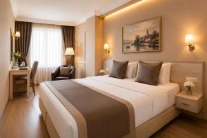 Llit o llits en una habitació de Classes Hotel Airport