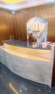 a sign for a ski shop with a bear on the counter at SIU Elite INN in Chennai
