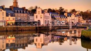 a view of a city with a river and buildings at Brit Hotel Le Galion & Spa in Binic