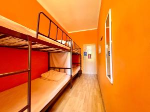 a hallway with two bunk beds in a room at Let's Rock Party Hostel! Age Limit From 18 until 40! in Krakow
