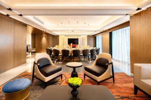 a conference room with a long table and chairs at Tian Yi International Hotel 天艺国际酒店 in Phnom Penh