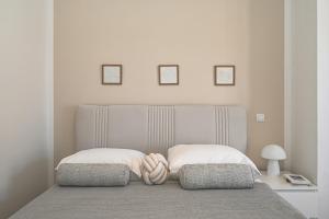 a bedroom with a bed with two towels on it at Casa Dalmatia in Krvavica