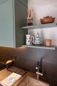 a kitchen with a sink and a counter top with a sink at Maison Luboz - Courmayeur in Courmayeur +108 photos