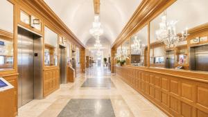 a hallway of a store with chandeliers at SeaStays Apartments in Miami Beach