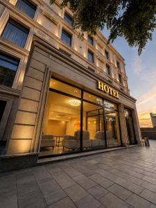 a store front of a hotel with couches in it at Delmont hotel in Kostanay