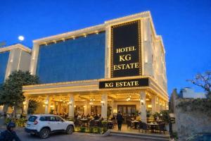 a hotel kx institute with a car parked in front of it at Hotel KG Estate in Jaipur