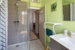 a bathroom with a shower and a sink at Demeure Olea in Chérac