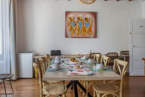 a dining room with a table and chairs at Demeure Olea in Chérac +35 photos