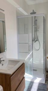 a bathroom with a shower and a sink at Pomorie appartement ad in Pomorie