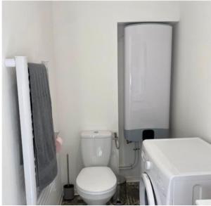 a small bathroom with a toilet and a sink at Pomorie appartement ad in Pomorie