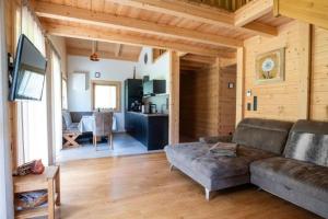 a living room with a couch and a table at Chalet am Zirm in Riobianco