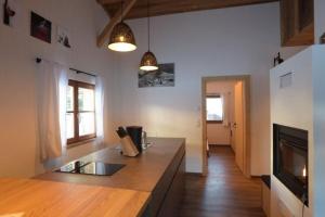 a kitchen with a counter top in a room at Ausserhof Hütte mit Sauna Südtirol in Riobianco