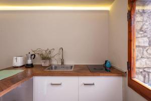 a kitchen with a sink and a counter top at Central Gucciardini house in Florence