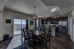 a kitchen and dining room with a table and chairs at Executive Stay for Work & Family in Rapid City