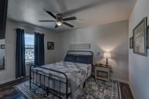 a bedroom with a bed and a ceiling fan at Executive Stay for Work & Family in Rapid City