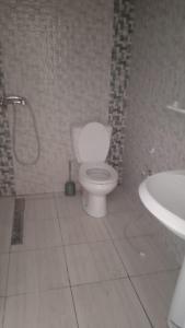 a bathroom with a toilet and a sink at appart CRISTIANA 3 Midoun in Midoun