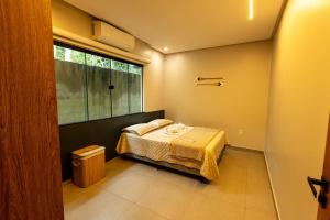 a small bedroom with a bed and a window at Alter Casa Sawe, Alter do Chão, PA in Santarém +84 photos