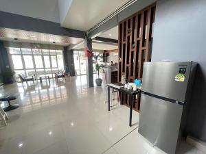 a kitchen with a refrigerator and a dining room at Bann Lhong Rak Krabi in Krabi +125 photos