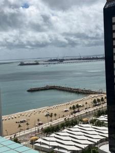 a view of a beach with a pier and the ocean at Brasil Tropical Luxury Ocean View in Fortaleza +19 photos