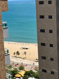 a view of a beach from a building at Brasil Tropical Luxury Ocean View in Fortaleza