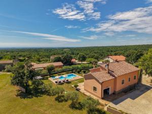 an aerial view of a house with a swimming pool at Villa Antonela in Radetići