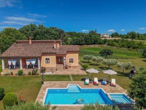 an aerial view of a house with a swimming pool at Villa Antonela in Radetići