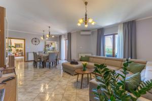 a living room with a couch and a table at Villa Antonela in Radetići